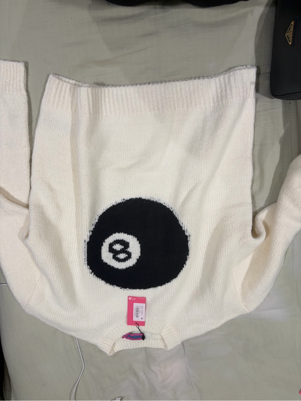 Edikted Cream Sweater with Black 8-Ball Graphic